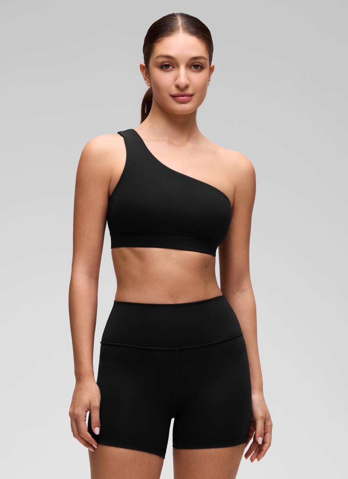 CRZ YOGA Butterluxe Womens One Shoulder Sports Bra Asymmetrical Padded Black @model_info:Inga